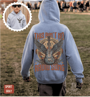 A person wearing a grey hoodie with a graphic design of a guitar and the text